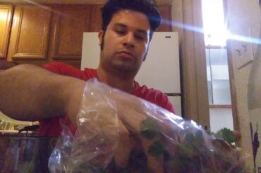 EATING CHILI WITH BEANS SOUR CREAM AN CHIVES ONIONS WITH BREAD AND BUTTER