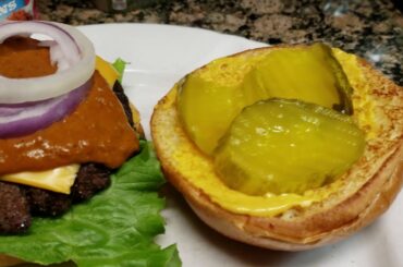 My Texas Delicious Chili Cheese Burgers | Served On A Brioche Bun | Topped With Onions Ring & Fries