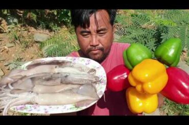 Yummy cook octopus with big chili -  eating  delicious