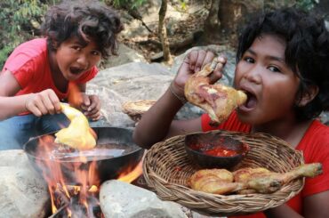 Fried chicken thigh eat with chili sauce in forest