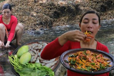 Cooking hot spicy chili shrimp with sweet mango for food in jungle very delicious