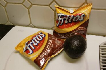 Enjoying some snack foods Chili cheese Fritos with avocado (OFL 1159)