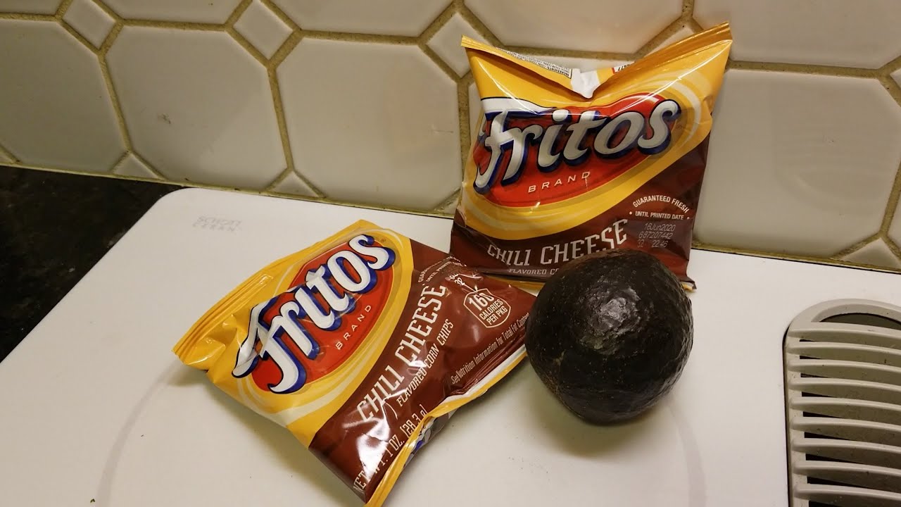 Enjoying some snack foods Chili cheese Fritos with avocado (OFL 1159