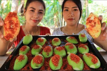 Eating green mango with chili salt