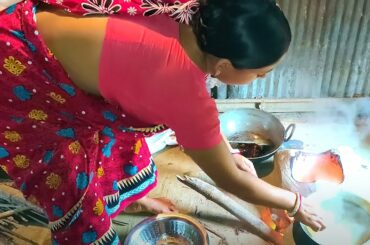 Two Village girls working together to make spicy chili food