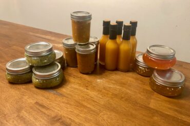My weekend consisted of making kiwi/jalapeño jam, salsa, pineapple-mango ghost pepper hot sauce, and habanero jam (as seen from left to right)