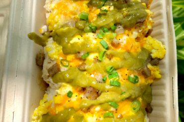 drizzled Jalapeño Salsa Cremosa on an order of biscuits & gravy from a local food truck in Austin, TX. southern comfort food just got HOT
