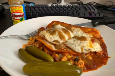 Black bean enchiladas with eggs, Israeli pickles, and of course El Yucateco XXXtra Hot