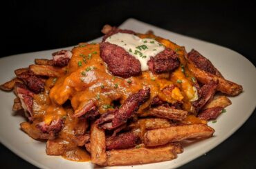 Smoked Chicken Wing Poutine with Spicy Buffalo gravy