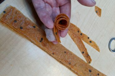 Fiery hot fruit rollups. Manzano/apple/ginger/garlic "fruit" leather? Spicy fruit jerky?