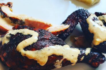 Smoked chicken with a homemade cajun white BBQ sauce