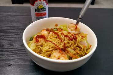 Just some Mi Goreng instant noodles with Shrimp, Onion, Cabbage, Carrots, Garlic and a bit of Yellowbird Ghost Pepper Condiment.