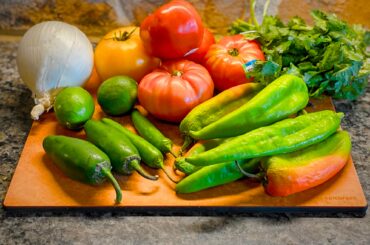 My favorite time of year. About to roast some hatch salsa with heirloom tomatoes (garlic not pictured)