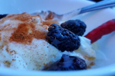 Usually it's breakfast, but today it's a late snack. Fage Greek yogurt, raw honey, cayenne powder, blackberries and a fresh cayenne pepper.