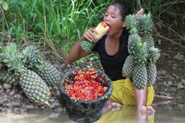 Pineapple with Hot salt chili for food and Eating delicious in the jungle