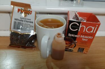 Orange Spiced tea with 3 drops of Harbenaro and a clove for warm burn.