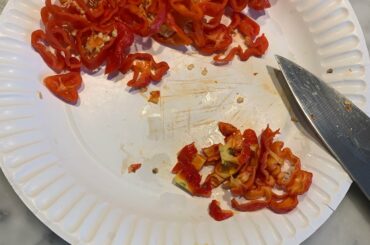 A reaper from my garden along with five (store-bought) habaneros headed into a beef and spicy sausage chili tonight. I didn’t dare use my wooden cutting board.