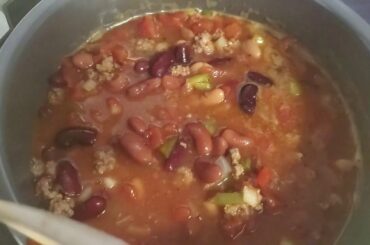 Cooking chili and painting window