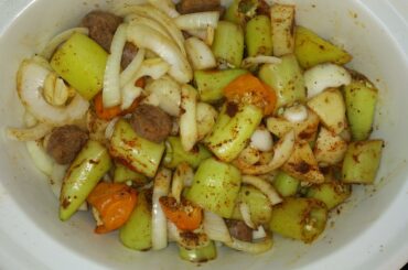 Crockpot sausage, potatoes and peppers. 4 hours to go. Hot hungarians, habaneros and crushed red.