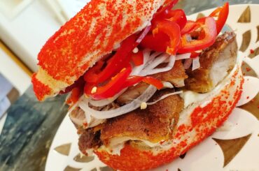 Hot cheeto bagel sammich with lechon (deep fried pork with the crispy skin, mayo, thinly sliced onions and of course, spicy peppers lol