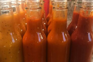 Homemade Hot Sauces L - R: Habanero Peach, Reaper, Ghost, Cranberry Lime & Reaper.