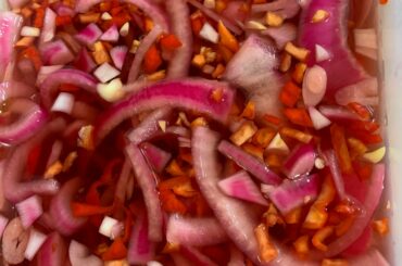 Pickled Red Onions with Garlic & Reapers. They hurt so good.