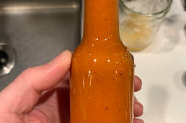 Homemade habanero, scotch bonnet and garlic hot sauce. Absolutely delicious!