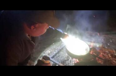 Cooking Chili in a Cast Iron Dutch Oven over a Campfire