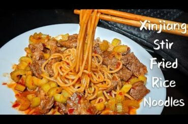 Xinjiang Stir-Fried Beef Rice Noodles Recipe. The sauce is spicy and savory, the noodle is thick and chewy, the meat is tender, and the celery is crunchy. Very well balanced!
