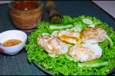 Pretty girl cooking  - Salad of duck eggs, chili, spicy sweet fish sauce - bunkea yanit