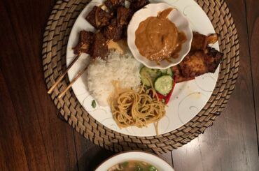 Spicy beef and tofu satay with peanut sauce, cucumber salad, miso soup, and peanut noodle salad!