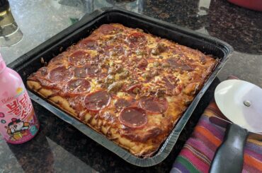 Motor City Pizza Co. Three-Meat pizza with red pepper flakes and Samyang Buldak Carbo sauce drizzle (love this sauce. Usually just use it for noodles)