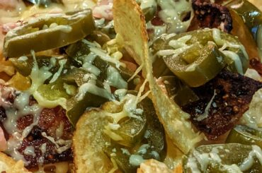Irish Nachos: a spicy and savory combo from Irish Cheddar, jalapenos, bacon, and pickled onions