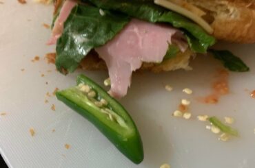 One bit croissanwich, one bite serrano pepper. Personally spicy for me but so good
