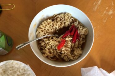Ramen noodles yellow gold noodles water soup six spicy chili pepper and white rice feild bokyin
