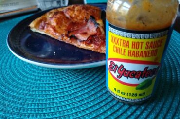 Other hot sauces come and go, but El Yucateco is forever. Leftover pizza for scale