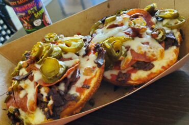 Bagel pepperoni pizza with peppers, chopped up steak and F@*king hotsauce