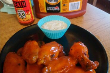 Wings coated in Frank's and Blair's ultra death with blue cheese sauce.