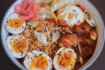 The usual. 2x spicy ramen, gyozas, boa bun, soft boiled eggs, spicy sriracha chicken, + extra samyang hot sauce in a miso-gochu broth