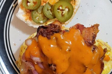 Hangover cure - BEC with cream cheese, pickled japenos and habaneros on an everything bagel with Melindas ghost pepper wing sauce