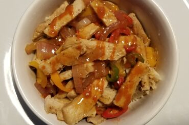 My favorite Sunday dinner - pork with rice, onion, serrano, habanero, long red chiles, sweet peppers and sriracha