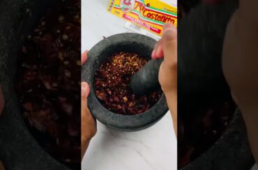 Most Satisfied Crushing of Hot Peppers to Make Chilli Powder