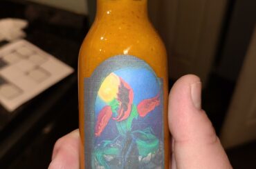 Homemade miso ghost hot sauce with label. Nerd Burn.