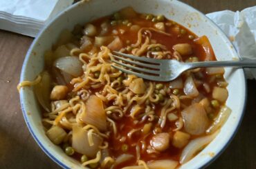 Buldak 2x Spicy Ramen with Scallops, Onions, and Peas. Yummy!