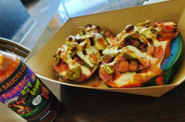 Pepperoni bagel pizza with bacon, peppers and hotsauce