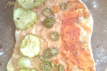 Not everyone likes my sandwiches: home made flatbread, peanut butter, Mr Naga, home grown pickled jalapenos and Chinese dragon tongues, home grown pickled cucumbers