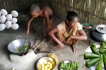 Santali child learning anda curry cooking with big green chilli | egg cooking recipe