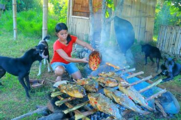 Women Cooking Fish with spicy chili for dog  Eating delicious
