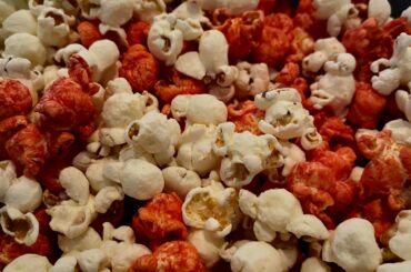 Regular popcorn cut with Smartfood flaming hot.