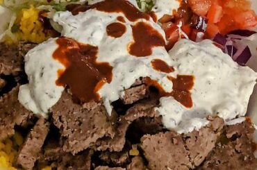 Homemade Halal Guys. Turmeric rice, beef/lamb gyro, lettuce, tomato, red onion, tzatziki sauce, and (the star of the show) Halal Guys hot sauce!